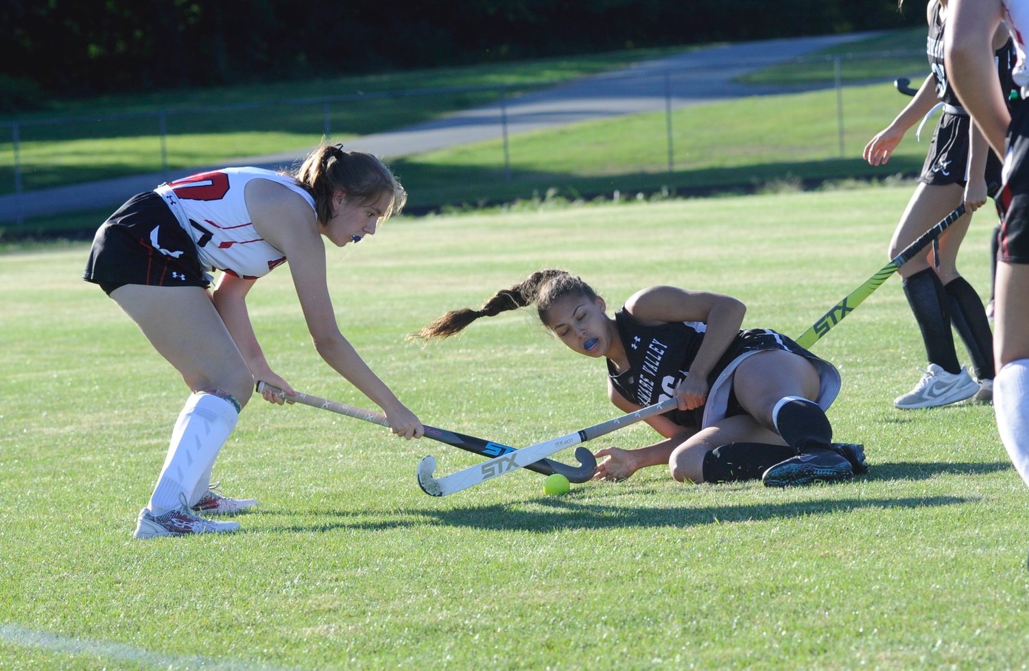 Never give up! Despite getting knocked to the turf, Ella Smith of the Lady Warriors continues the fight against Honesdale’s Ava Babel...